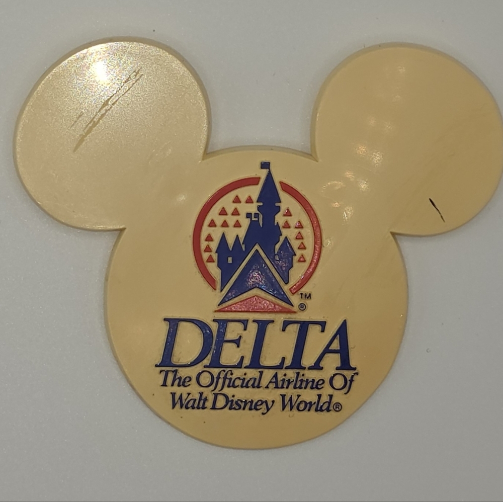 Delta Cream and Blue Disney Button